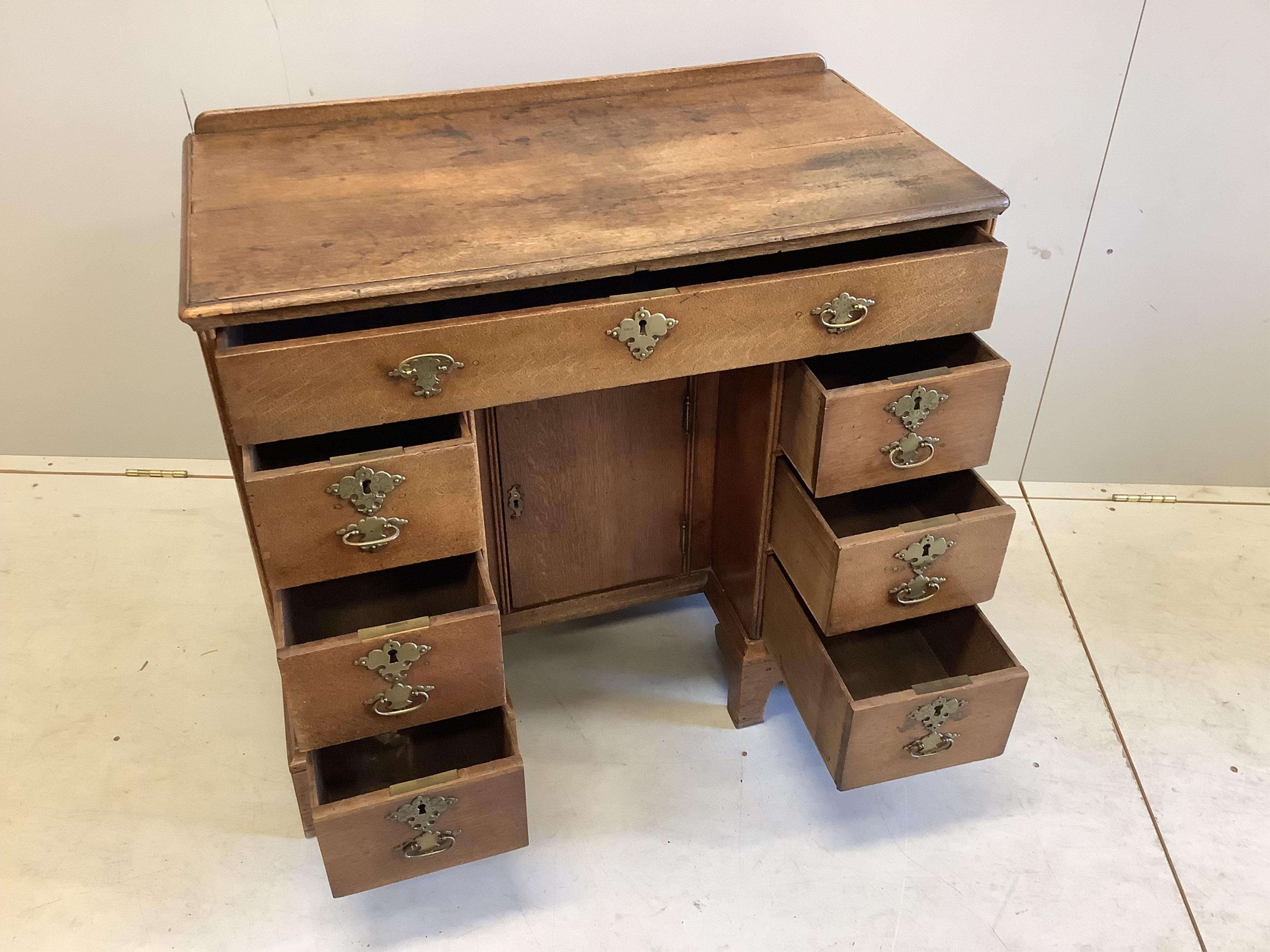 A George lll Provincial oak kneehole desk, width 86cm, depth 46cm, height 78cm. Condition - fair